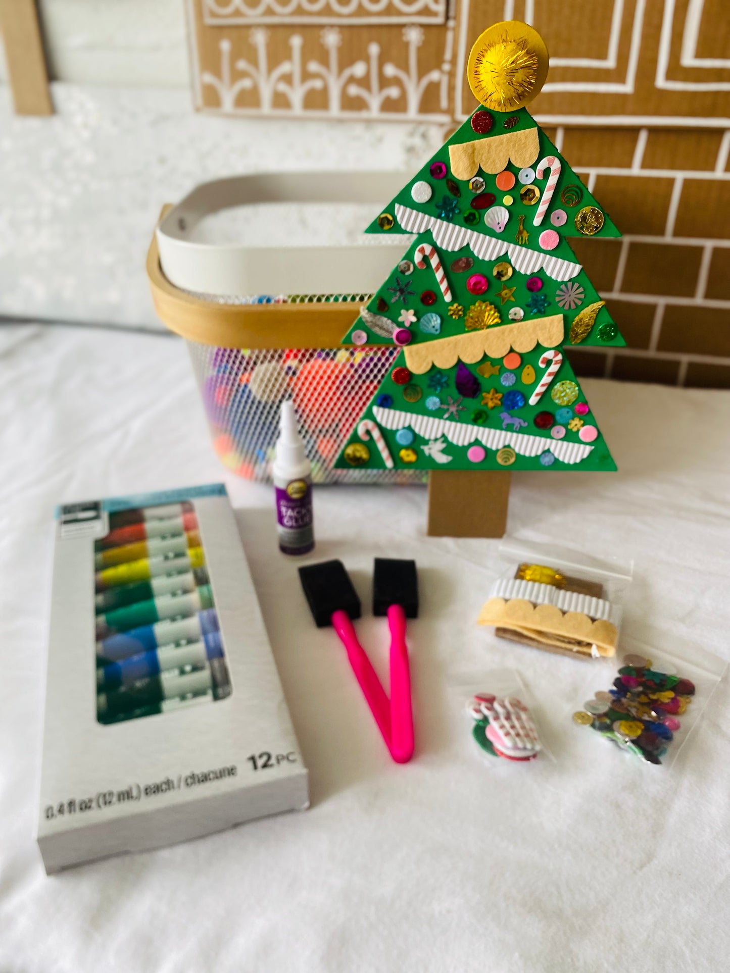 Christmas tree craft kit contents laid out on table